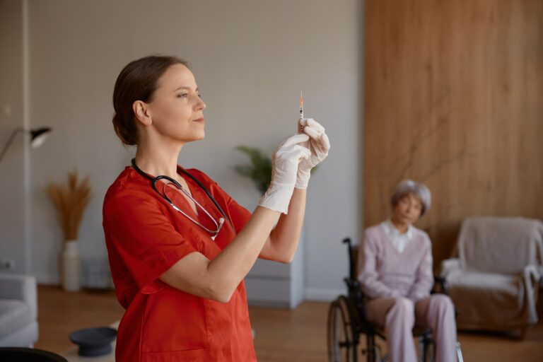 Woman,Nurse,Preparing,Syringe,For,Vaccination,Of,Old,Lady,Patient